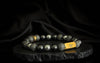 Rengetsu Enkan Flame Crown luxury Onyx men’s bracelet 18 cm displayed on black stone with draped satin background – signature piece photoshoot