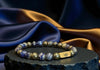 Rengetsu Hado Path of Dominance luxury Lapis Lazuli men’s bracelet 16 cm displayed on black stone with draped blue satin background – signature piece photoshoot